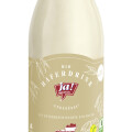 A glass bottle of organic oat drink with a beige label featuring the brand "Ja! Natürlich," text indicating it's unsweetened, and logos for vegan and organic certification.