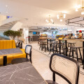 The modern interior offers plenty of seating for the next lunch.