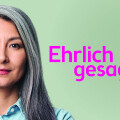 A person with long gray hair and a denim shirt against a light green background. Large pink text reads "Ehrlich gesagt," with smaller text "Eine Initiative von Bipa" in white.