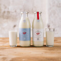 Range family: Ja! Natürlich organic light milk and whole milk in environmentally friendly returnable glass bottles