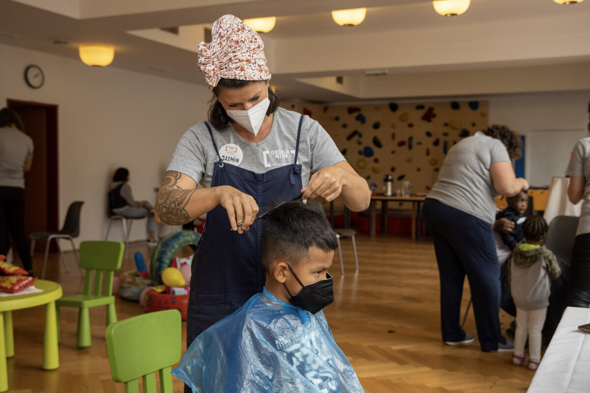 Children of homeless families who have just found a transitional home at the facility were invited to a haircut.