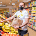 Frantisek Antono, BILLA Fruit & Vegetables Department Manager, fills paper carrier bags with fruit and vegetables from packaging units in which, for example, a single piece is damaged, or which has minor blemishes but is perfectly edible.